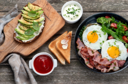 breakfast of eggs and toast ith avocado